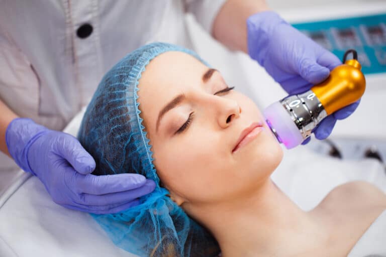 woman receives laser skin resurfacing on face